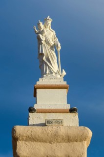 Statue of Madonna Mary Mother of God on Ramla Bay Beach
