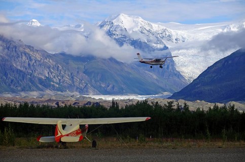 Small planes and snow-capped mountains and glaciers