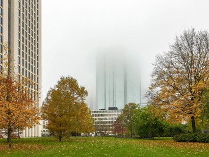 Deutsche Bank in the fog behind Rothschild Park in autumn colours