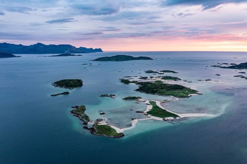 View of small islands in the sea near Sommaroy