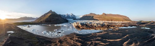 Glacial river in front of Mountains with Hvannadalshnukur