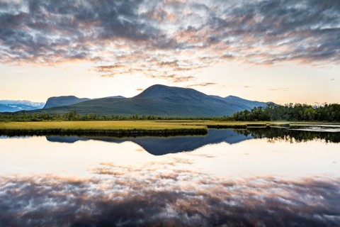 Mountains reflected in small lake