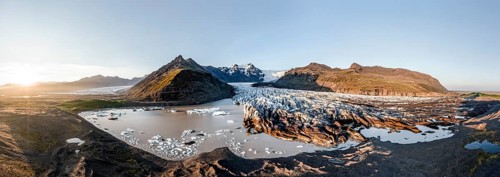 Glacial river in front of Mountains with Hvannadalshnukur