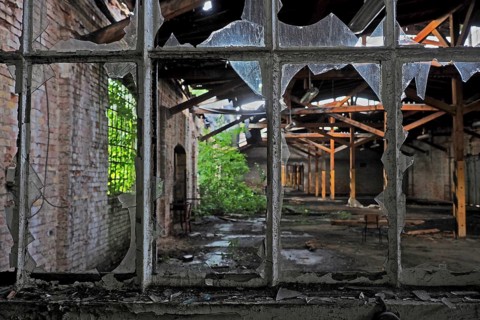 View through broken window in railway station