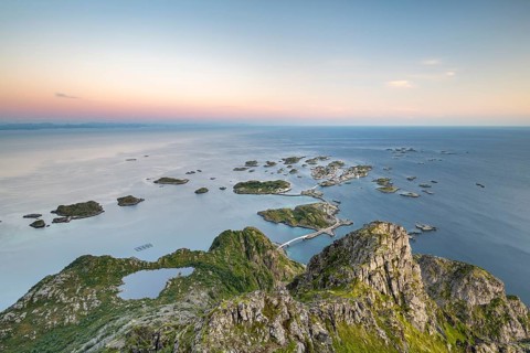 View of fishing village Henningsvaer from the top of Festvagtinden