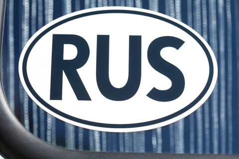 Russian car number plate on a car window