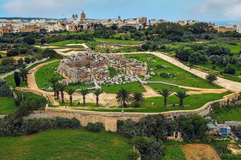 Bird's eye view of historic Neolithic Ggantija temple from temple complex of megalithic culture