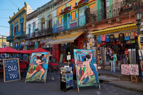 Colourful house facades and posters in the La Boca district