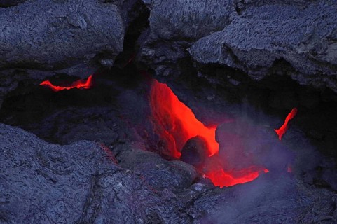 Magma glows under cooled lava