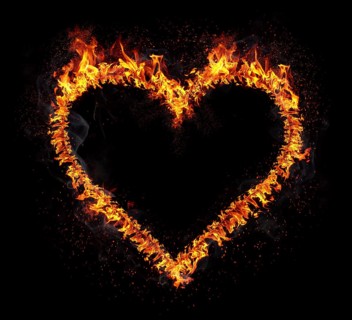 Flaming heart isolated on black background