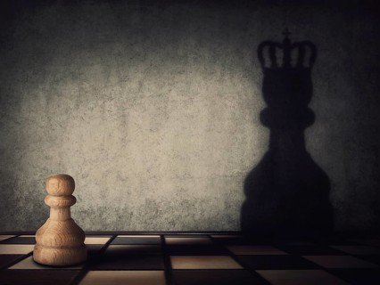 Surreal transformation of the pawn chess piece into a powerful king or queen