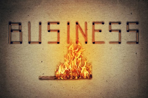 Burning match setting fire to its neighbors in arranged in shape of business word