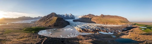 Glacial river in front of Mountains with Hvannadalshnukur