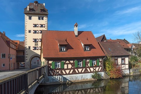 Historic water gate with town coat of arms