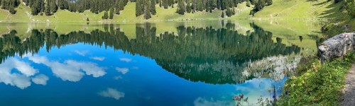 Reflections in the Oberstockesee lake on the Stockhorn