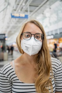 Young woman wearing glasses and an FFP-2 mask