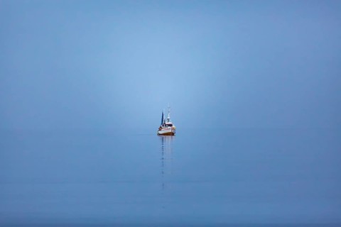Fishing vessel alone at sea