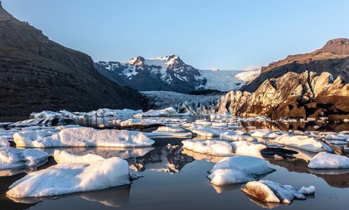 Glacial river in front of Mountains with Hvannadalshnukur