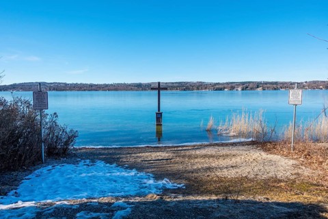 Memorial cross at the spot in the shallow shore area of Lake Starnberg where King Ludwig II of Bavaria was found dead in 1886