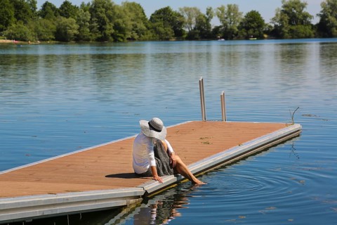 Woman with sun hat on jetty