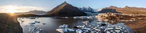 Glacial river in front of Mountains with Hvannadalshnukur