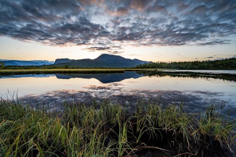 Mountains reflected in small lake