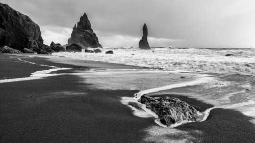 Lava rocks and rock needles on the black lava beach Reynisfjara