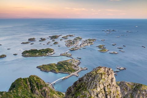 View of fishing village Henningsvaer from the top of Festvagtinden