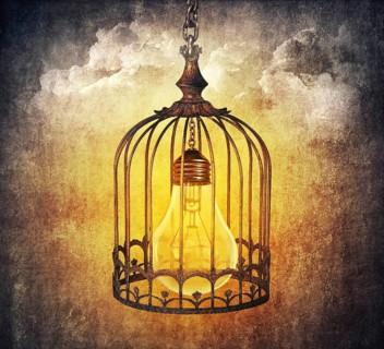 Light bulb locked in a old cage
