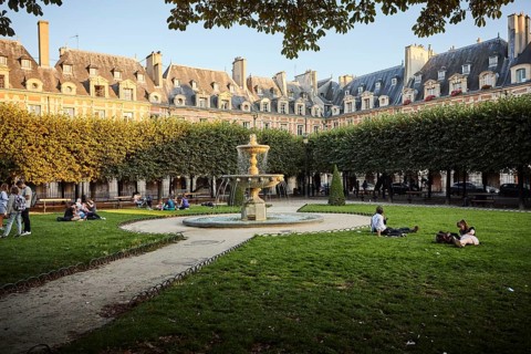 Evening atmosphere with fountains in front of medieval facades