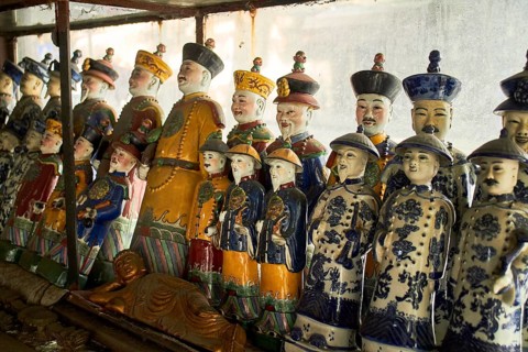 Emperor figures of coloured porcelain in antique shop