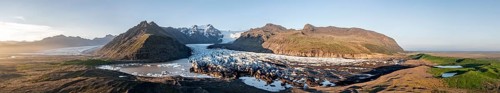 Glacial river in front of Mountains with Hvannadalshnukur