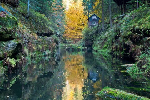 Autumn in the Edmundsklamm gorge with the river Kamenice