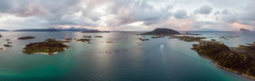 View over the sea with fish farms to Baltsfjorden and the mountains of Balten