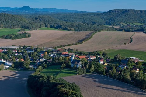 Papstdorf with Papsdorf Church seen from the Papststein