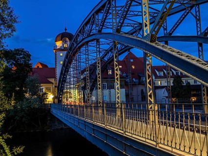 Waasen bridge over the river Mur and historic toll tower