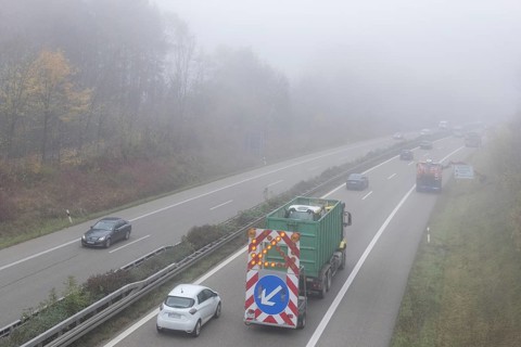 Escort vehicle for protection during mowing work on motorway in autumn
