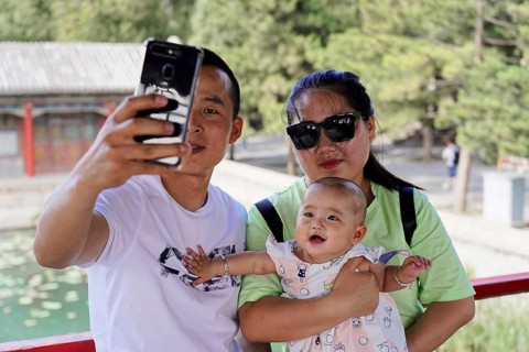Chinese couple with child on a trip to the Summer Palace