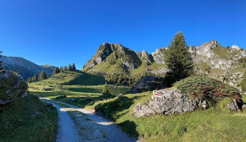 Hiking trail marking on a stone at Seebergsee