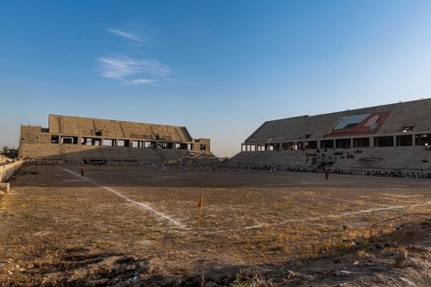 Soccer game in the ruins of the soccer stadium of Mosul
