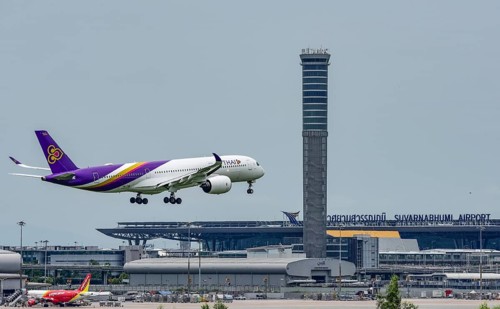 Air traffic control tower Suvarnabhumi Airport and Thai Airways Airbus A300-600 aircraft