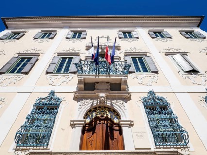 Flags flying at the late Baroque palace Besenghi degli Ughi