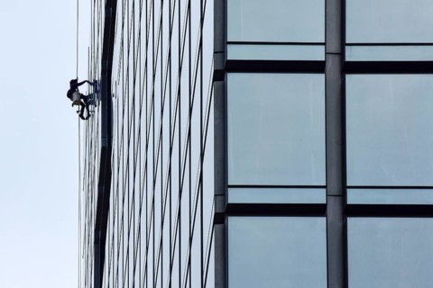 Man cleaning window pane