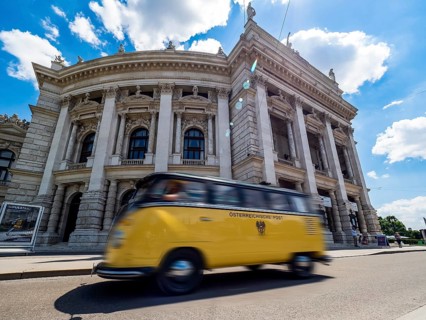 Old post bus in front of the Burgtheater