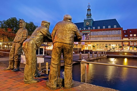 Bronze statues of dolphin spitters on the Ratsdelft in front of the Ostfriesisches Landesmuseum
