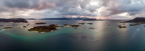 View over the sea with fish farms to Baltsfjorden and the mountains of Balten