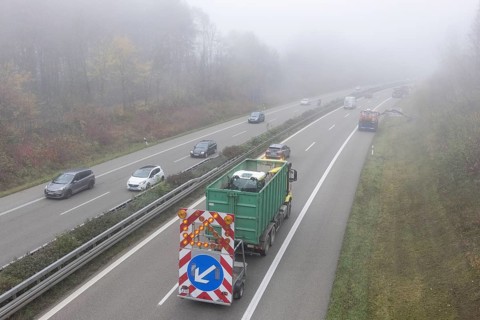 Escort vehicle for protection during mowing work on motorway in autumn