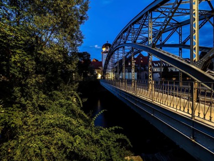Waasen bridge over the river Mur and historic toll tower