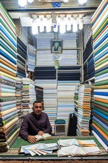 Man in his cloth shop in the Imam Ali Holy Shrine