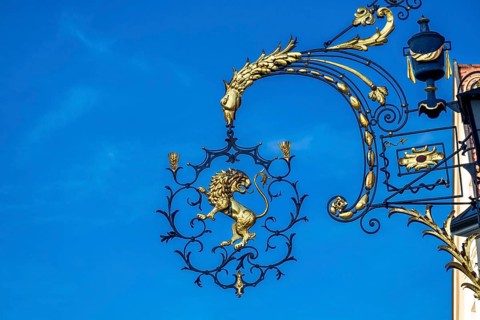 Guild sign on the former Goldener Loewe inn in the historic old town